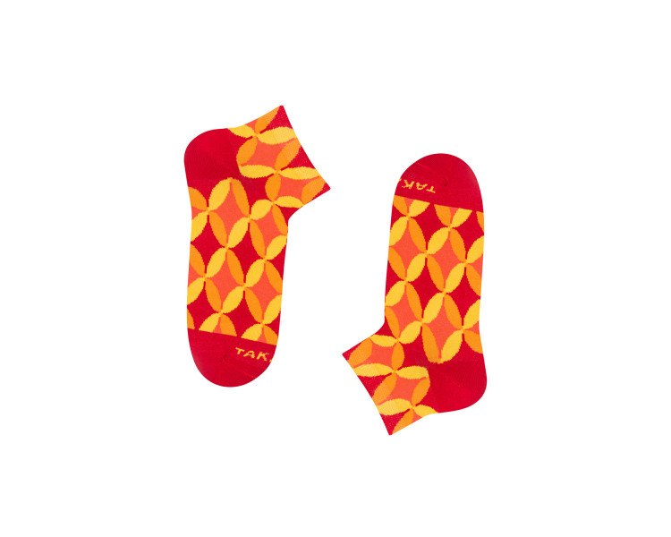 Colorful Piłsudskiego 4m4 sneaker socks with orange, red geometric patterns. Takapara
