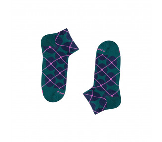 Chaussettes baskets colorées Wólczańska 7m2 à pois bleu marine sur fond vert foncé. Takapara